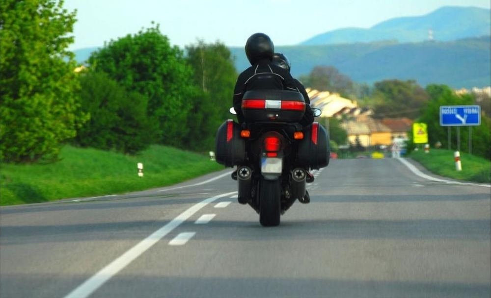 Two motorcyclists sharing a carpool ride